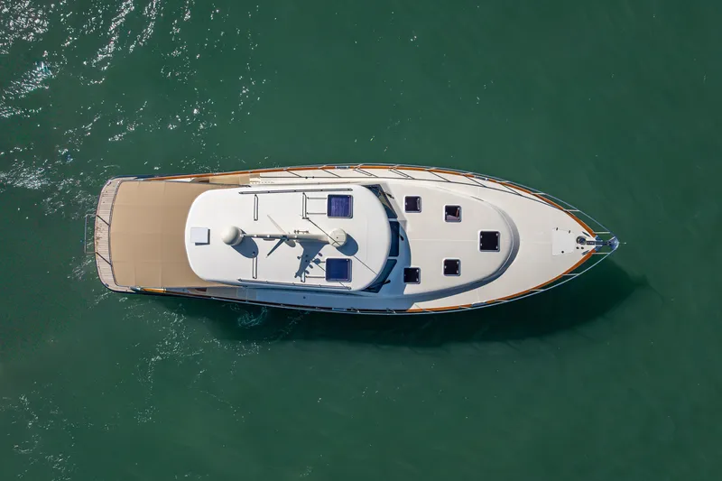 Eleven11 Yacht Photos Pics Overhead view of 2018 Palm Beach Motor Yachts PB55 on calm water.
