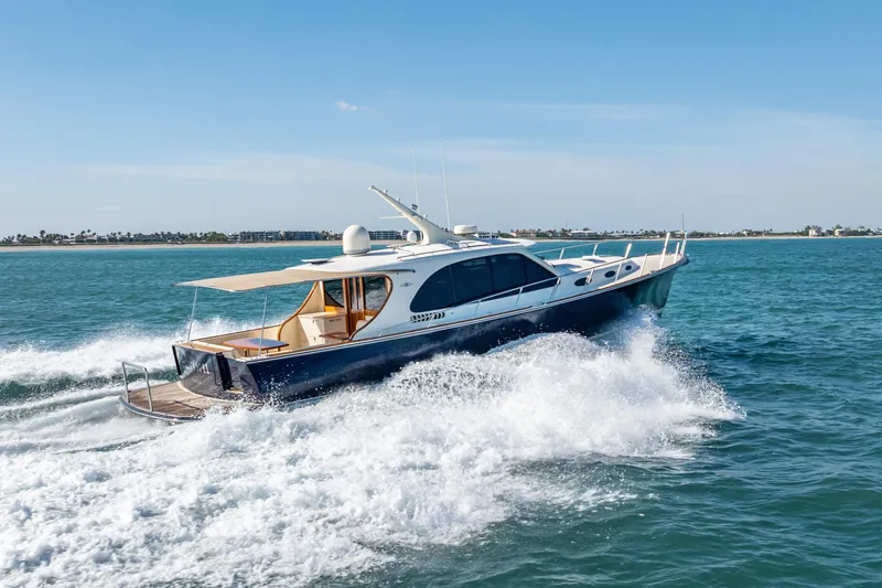 Eleven11 Yacht Photos Pics 2018 Palm Beach Motor Yachts PB55 cruising on open water, showcasing sleek design and performance.
