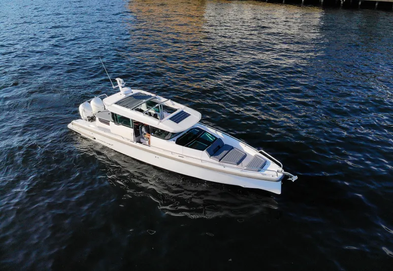  Yacht Photos Pics 2021 Axopar 37XC Aft Cabin cruising on calm waters.