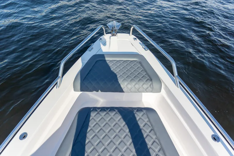  Yacht Photos Pics Bow seating area of 2021 Axopar 37XC Aft Cabin on water.