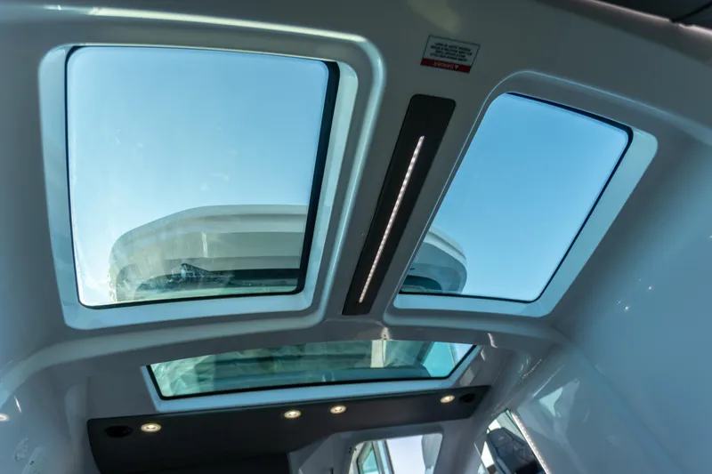 Yacht Photos Pics Sunroof view inside 2021 Axopar 37XC Aft Cabin, showcasing modern design and natural light.
