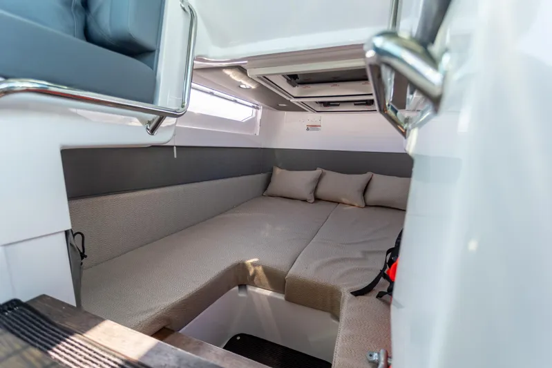  Yacht Photos Pics 2021 Axopar 37XC Aft Cabin interior with cozy seating and cushions.