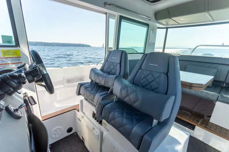  Yacht Photos Pics Interior of 2021 Axopar 37XC Aft Cabin with luxurious seating and ocean view.