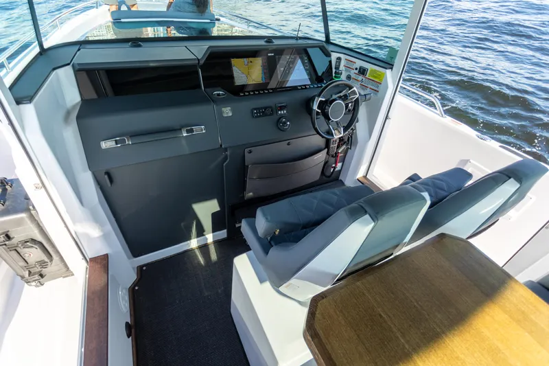  Yacht Photos Pics Interior of 2021 Axopar 37XC Aft Cabin with modern helm and seating.
