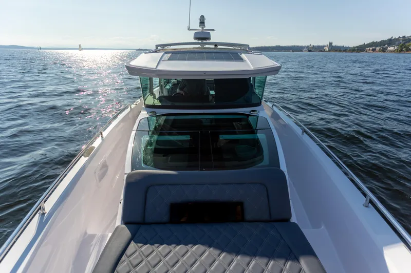  Yacht Photos Pics Axopar 37XC Aft Cabin 2021 cruising on a sunny day, showcasing sleek design and comfort.