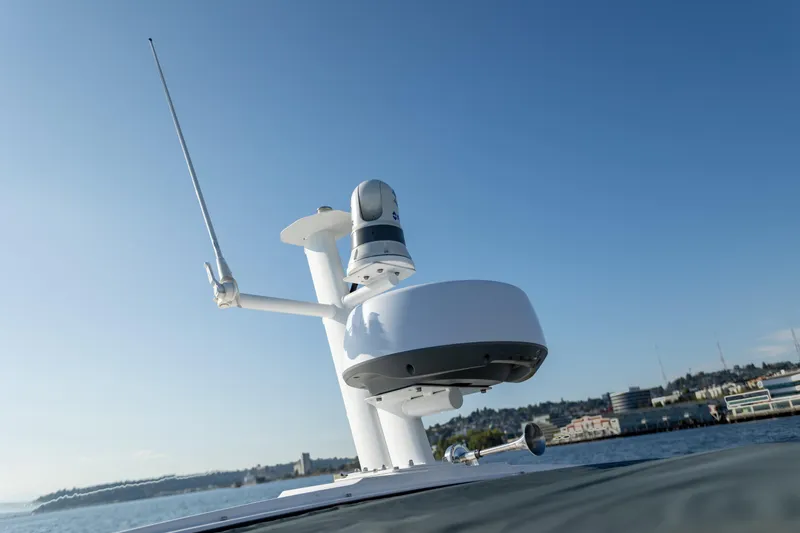  Yacht Photos Pics Rooftop equipment on 2021 Axopar 37XC Aft Cabin boat against clear blue sky.