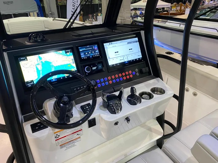  Yacht Photos Pics 2025 Edgewater 340CC boat dashboard with advanced navigation and control systems.