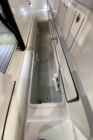  Yacht Photos Pics 2025 Edgewater 340CC boat interior storage compartment, sleek design, spacious layout.
