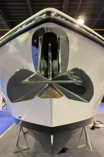  Yacht Photos Pics 2025 Edgewater 340CC boat bow with anchor, displayed indoors.