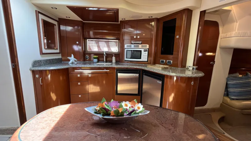 Lowest Price In Usa Yacht Photos Pics Luxurious 2008 Sea Ray 44 Sundancer yacht interior with modern kitchen and elegant dining area.