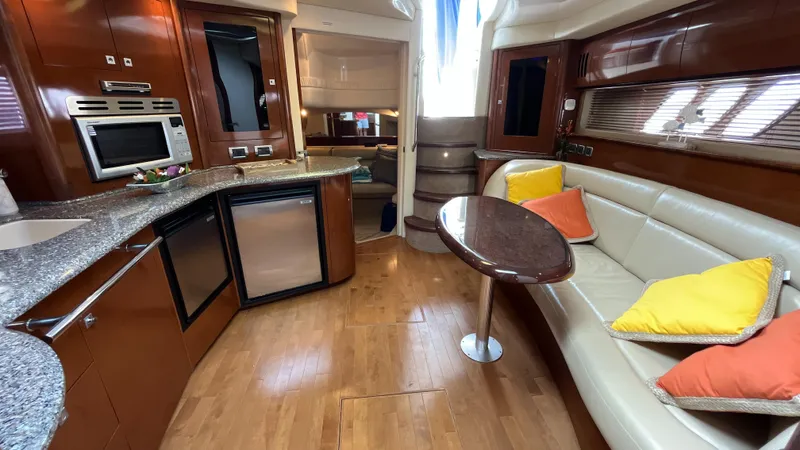 Lowest Price In Usa Yacht Photos Pics 2008 Sea Ray 44 Sundancer interior with kitchen, seating area, and modern amenities.