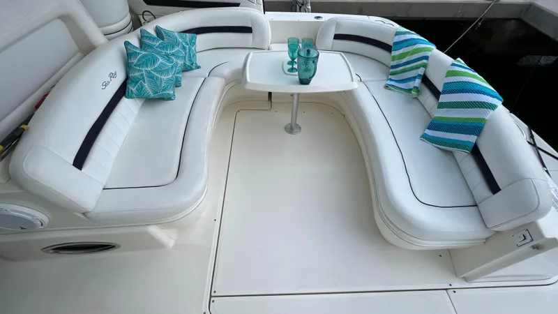 Lowest Price In Usa Yacht Photos Pics 2008 Sea Ray 44 Sundancer yacht with white seating, decorative pillows, and a small table.