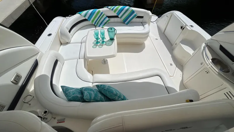 Lowest Price In Usa Yacht Photos Pics Luxurious seating area on a 2008 Sea Ray 44 Sundancer yacht with cushions and table.