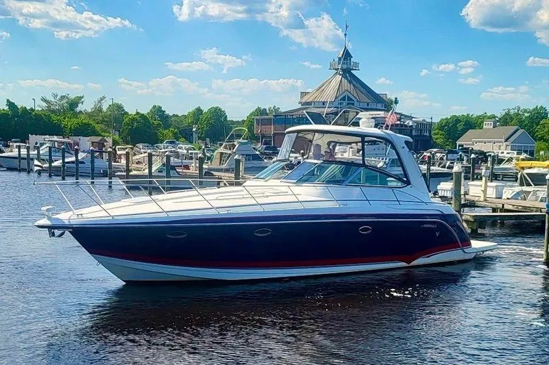  Yacht Photos Pics 2006 Formula 40 Performance Cruiser docked at a marina under a clear blue sky.