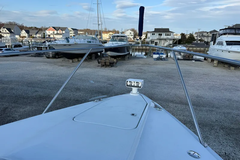  Yacht Photos Pics 2006 Formula 40 Performance Cruiser in marina, surrounded by boats and waterfront homes.
