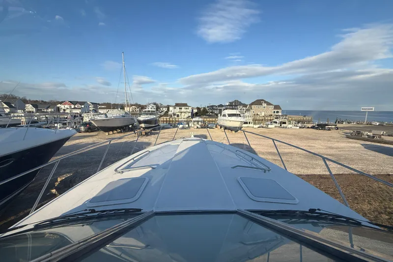  Yacht Photos Pics 2006 Formula 40 Performance Cruiser docked at a marina with coastal homes in the background.