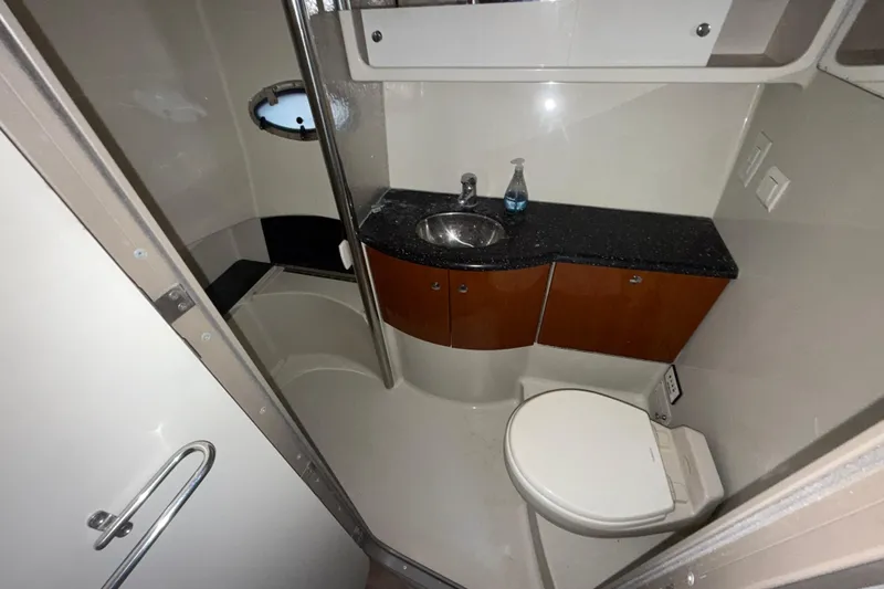  Yacht Photos Pics 2006 Formula 40 Performance Cruiser bathroom with sink, toilet, and storage cabinets.