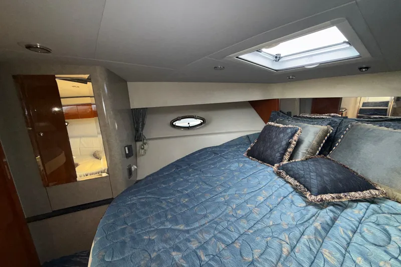  Yacht Photos Pics Interior of 2006 Formula 40 Performance Cruiser with cozy bed and skylight.