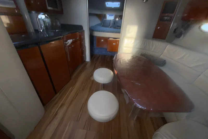  Yacht Photos Pics Interior of 2006 Formula 40 Performance Cruiser with wood flooring and modern furnishings.