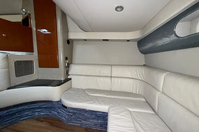  Yacht Photos Pics Interior of 2006 Formula 40 Performance Cruiser with white leather seating and wood accents.