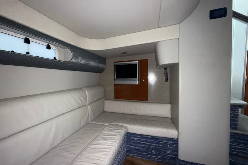  Yacht Photos Pics 2006 Formula 40 Performance Cruiser interior with white leather seating and wall-mounted TV.