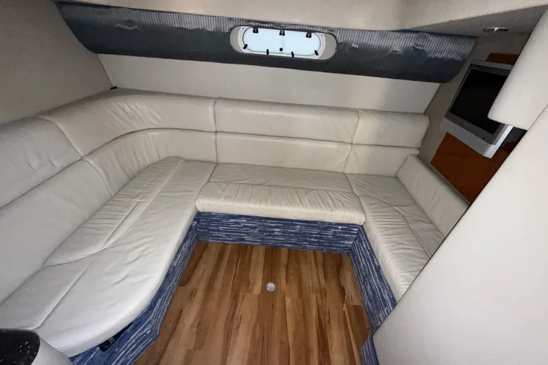  Yacht Photos Pics Interior of 2006 Formula 40 Performance Cruiser with white leather seating and wood flooring.