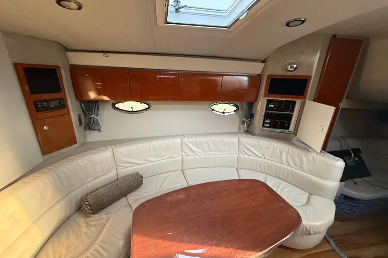  Yacht Photos Pics Interior of 2006 Formula 40 Performance Cruiser with white leather seating and wooden cabinetry.
