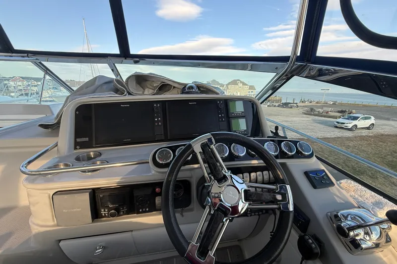  Yacht Photos Pics Helm of 2006 Formula 40 Performance Cruiser with modern navigation instruments and steering wheel.