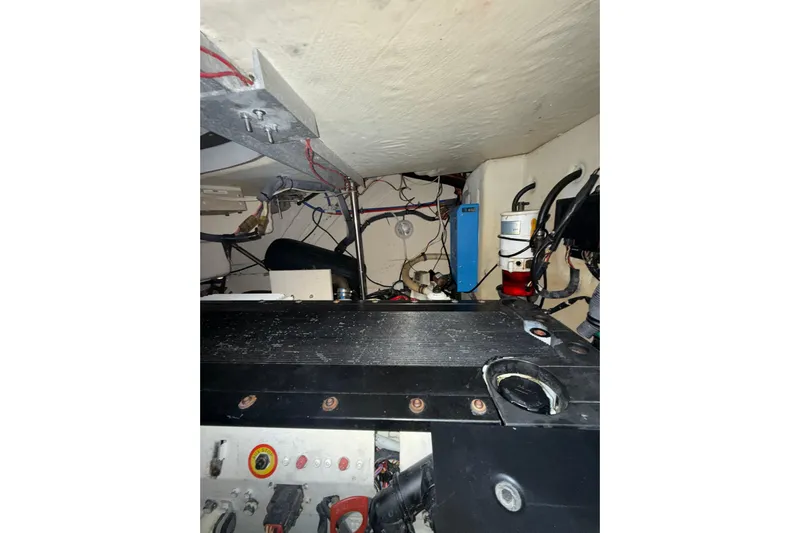  Yacht Photos Pics Engine room of a 2006 Formula 40 Performance Cruiser with visible wiring and components.