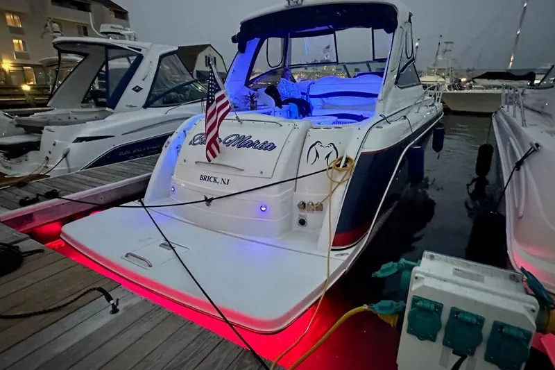  Yacht Photos Pics 2006 Formula 40 Performance Cruiser docked with illuminated deck and American flag.