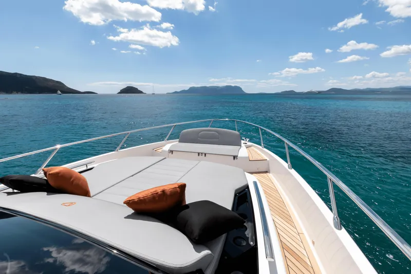  Yacht Photos Pics Luxury FIM 440 Regina yacht deck with cushions, cruising on clear blue waters, 2024 model.