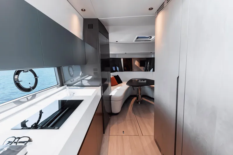  Yacht Photos Pics Modern interior of 2024 FIM 440 Regina yacht with sleek kitchen and seating area.