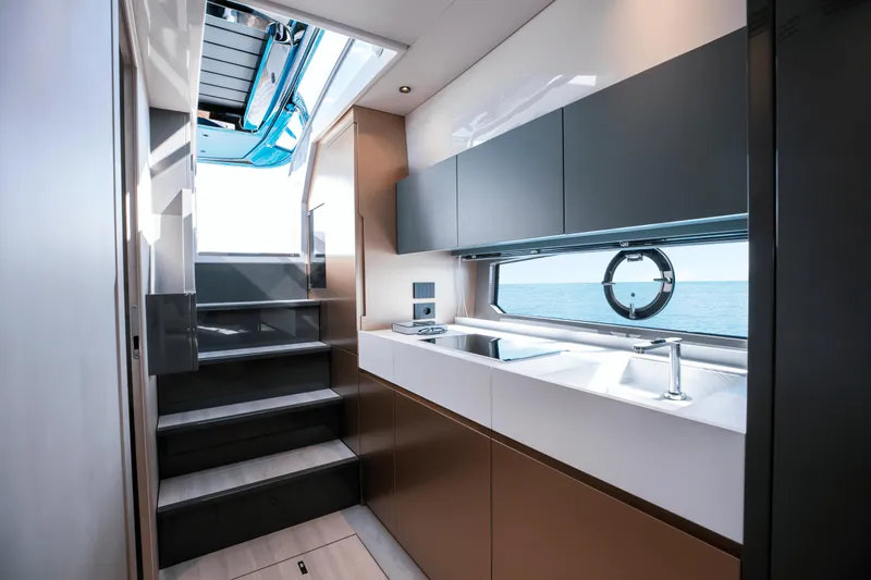  Yacht Photos Pics Modern interior of 2024 FIM 440 Regina yacht with sleek kitchen and ocean view.