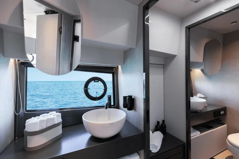  Yacht Photos Pics Modern bathroom interior on 2024 FIM 440 Regina yacht with ocean view.