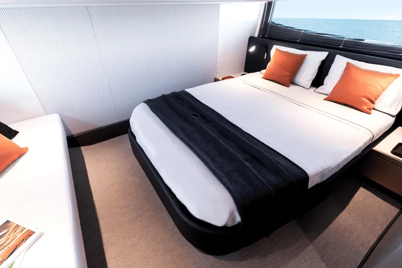  Yacht Photos Pics Luxurious bedroom interior on 2024 FIM 440 Regina yacht with ocean view.