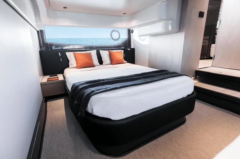  Yacht Photos Pics Luxurious bedroom interior of 2024 FIM 440 Regina yacht with ocean view.