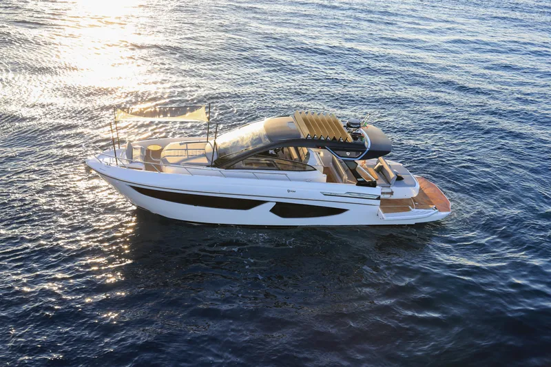  Yacht Photos Pics 2024 FIM 440 Regina luxury yacht cruising on serene blue waters.