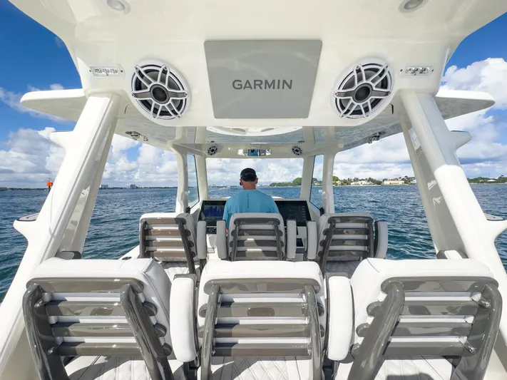 A Salt Weapon Yacht Photos Pics 2022 SeaVee 450z boat interior with Garmin electronics on open water.