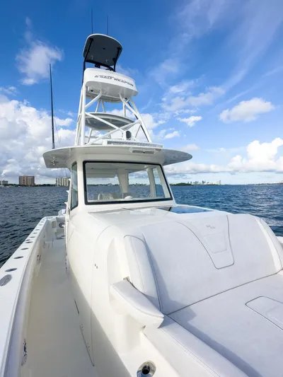 A Salt Weapon Yacht Photos Pics 2022 SeaVee 450z boat on water under blue sky.