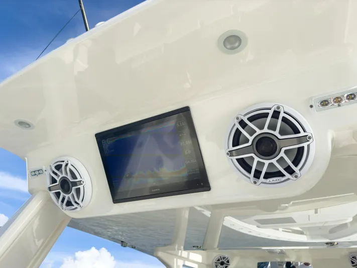 A Salt Weapon Yacht Photos Pics 2022 SeaVee 450z boat speakers and display screen under canopy.
