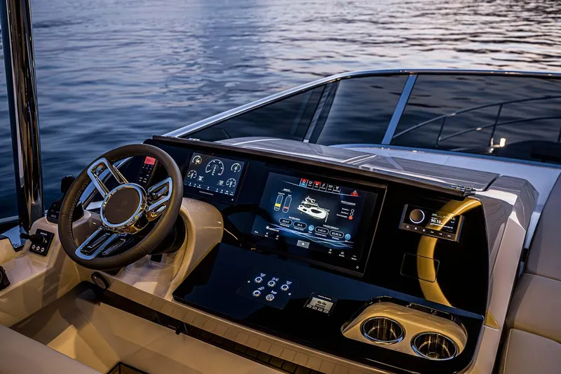  Yacht Photos Pics Luxurious helm of 2025 Absolute 52 FLY yacht with advanced navigation displays.