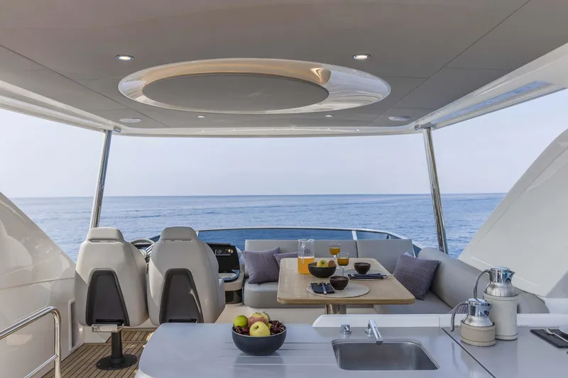  Yacht Photos Pics Luxurious interior of 2025 Absolute 52 FLY yacht with ocean view and modern amenities.