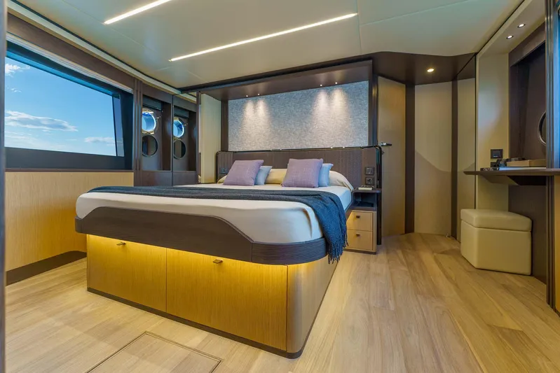  Yacht Photos Pics Luxurious bedroom interior of 2025 Absolute 52 FLY yacht with modern design and ambient lighting.