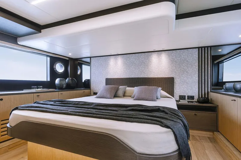  Yacht Photos Pics Luxurious bedroom interior of 2025 Absolute 52 FLY yacht with modern design and elegant decor.