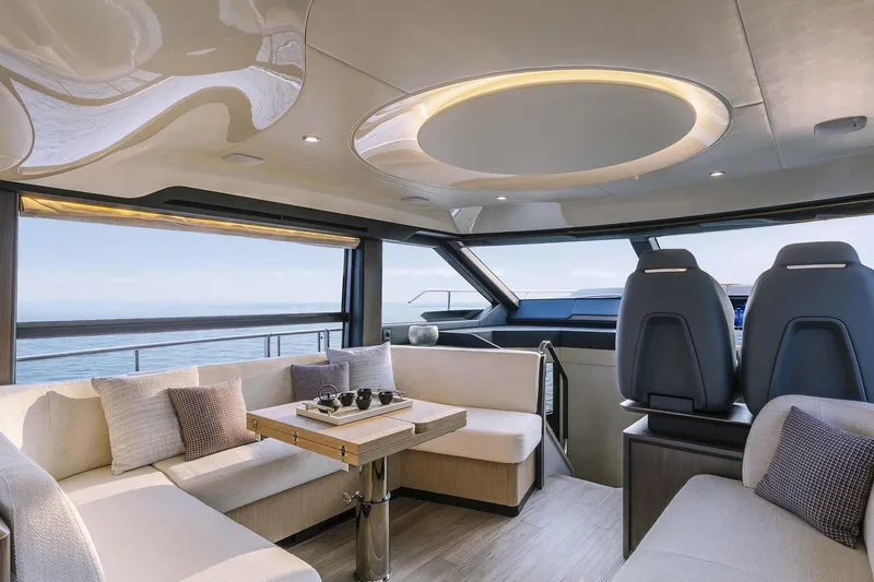  Yacht Photos Pics Luxurious interior of 2025 Absolute 52 FLY yacht with modern seating and ocean view.