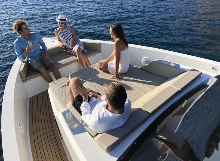  Yacht Photos Pics Four people relaxing on a 2026 De Antonio Yachts D42, enjoying the ocean view.