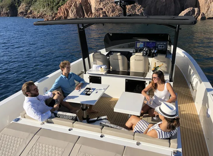  Yacht Photos Pics Four people relaxing on a 2026 De Antonio Yachts D42, enjoying a sunny day at sea.