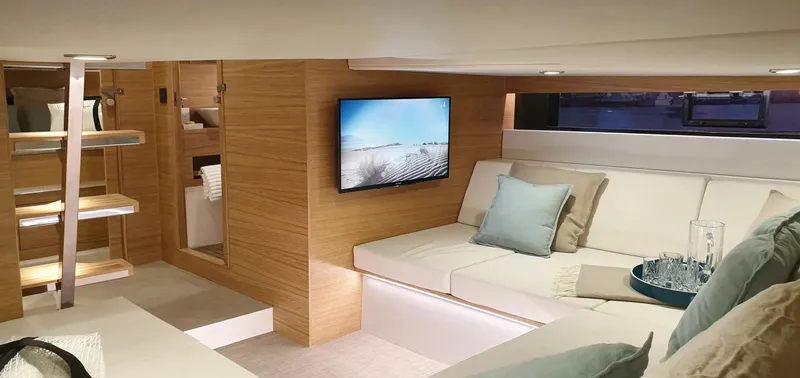  Yacht Photos Pics Luxurious interior of 2026 De Antonio Yachts D42 with modern seating and TV.