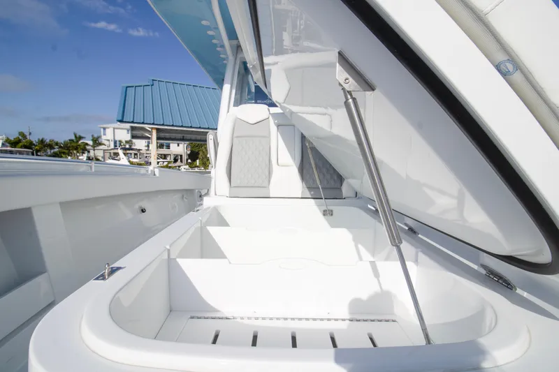  Yacht Photos Pics 2026 Invincible 39 Open Fisherman boat with open storage compartment, sleek design.