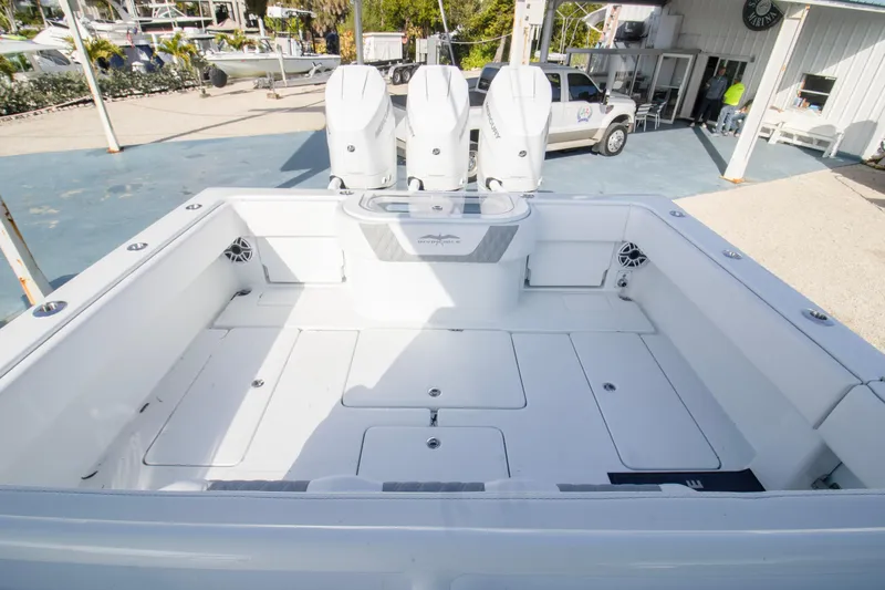  Yacht Photos Pics 2026 Invincible 39 Open Fisherman boat with triple outboard engines, spacious deck.